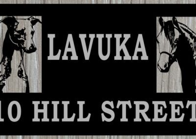 A sign displaying the text "Lavuka 10 Hill Street" prominently against a neutral background.