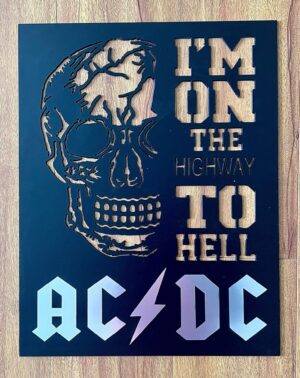 Metallic skull cutout with "I'M ON THE HIGHWAY TO HELL AC/DC" text on a blue background.