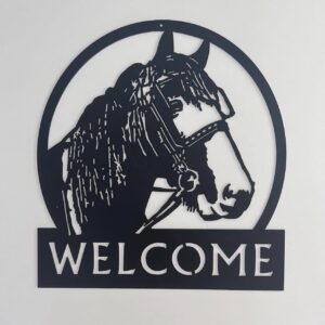 Black metallic welcome sign featuring a horse head within a circular frame.