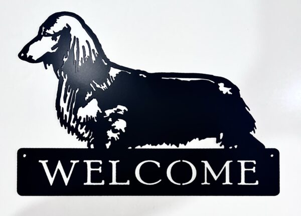 Silhouette of a dog above a "WELCOME" sign.