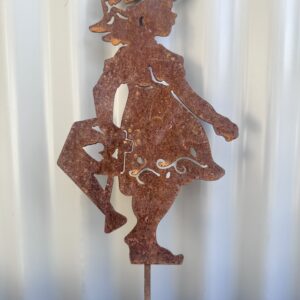 Rusty metal silhouette of a playful young girl against a corrugated backdrop.