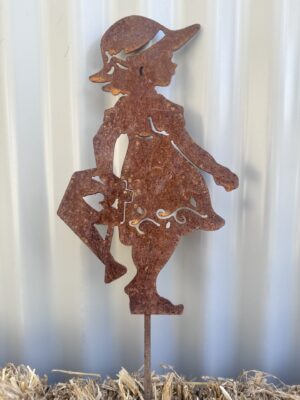 Rusty metal silhouette of a playful young girl against a corrugated backdrop.