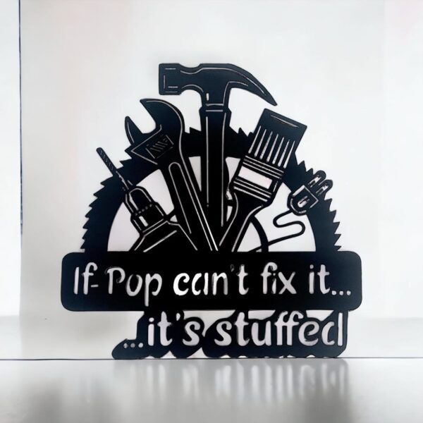 Black decorative plaque with tools and text "If Pop can't fix it... it's stuffed."