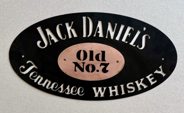 Oval-shaped Jack Daniel's logo sign with "Old No.7 Tennessee Whiskey" text.