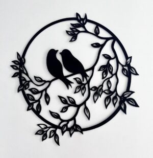 Black silhouette of two birds within a leafy wreath against a white background.