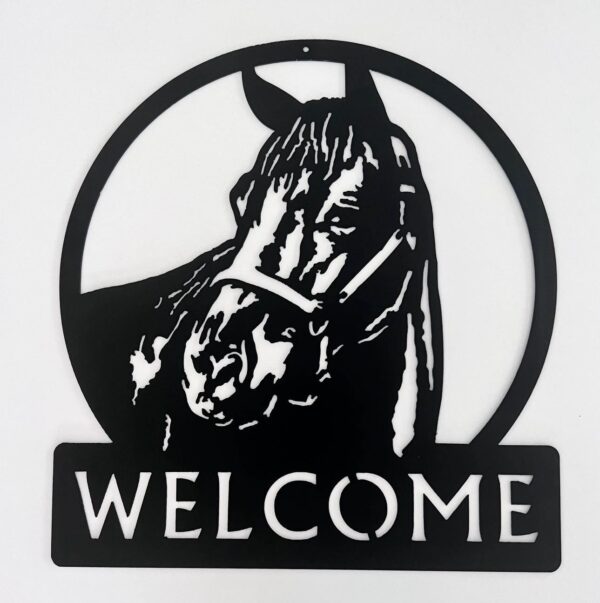 Circular metal sign with horse head silhouette above a "WELCOME" plaque.