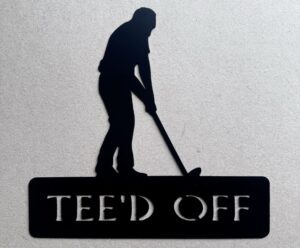 Silhouette of a golfer putting with the caption "TEE'D OFF SAKE" below.