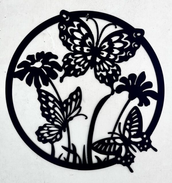 Circular black metal wall art featuring silhouettes of butterflies and flowers.