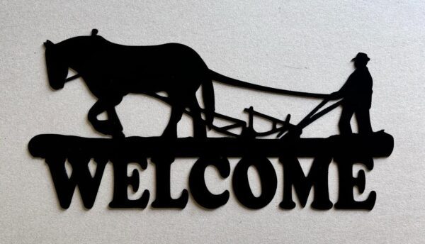 Silhouette of a farmer with a horse and plow above the word "WELCOME".