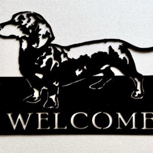 Metal silhouette of a dachshund on a 'WELCOME' sign.