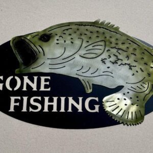 Oval sign with a fish illustration and the words "GONE FISHING" on a dark background.