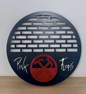 Round metal Pink Floyd decor featuring band's name and crossed hammer logo.