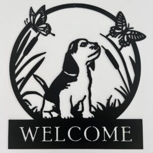 Black metal welcome sign with a dog and butterflies design.