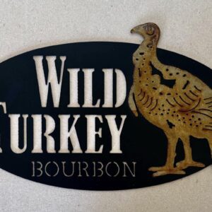 Oval-shaped sign with "Wild Turkey Bourbon" text and turkey graphic on black background.