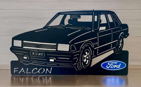 Silhouette of Ford Falcon car with logo on a stand.